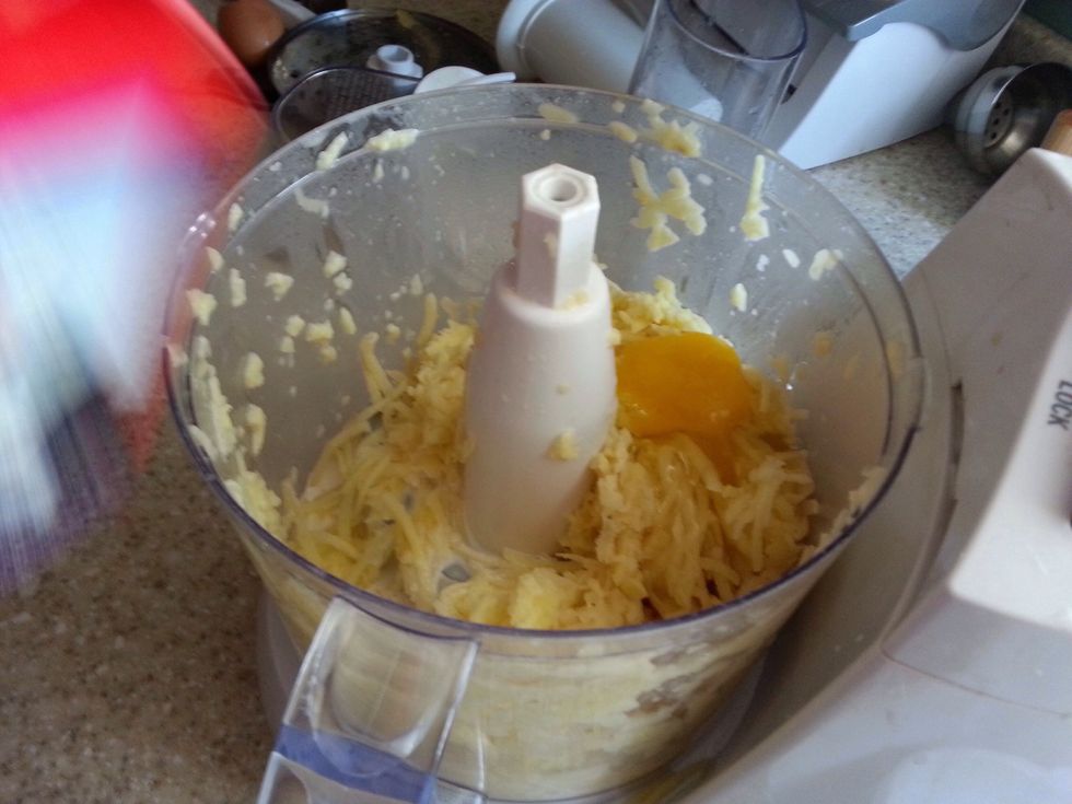 In batches, add shredded potatoes to food processor. Add an egg and splash of half and half (or evaporated milk). Mix to chopped consistency.