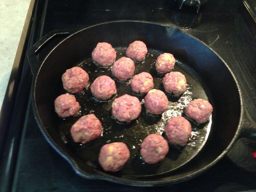 In batches brown up the meatballs. We're looking just to get some good colour on the outside, they'll finish cooking in the sauce.
