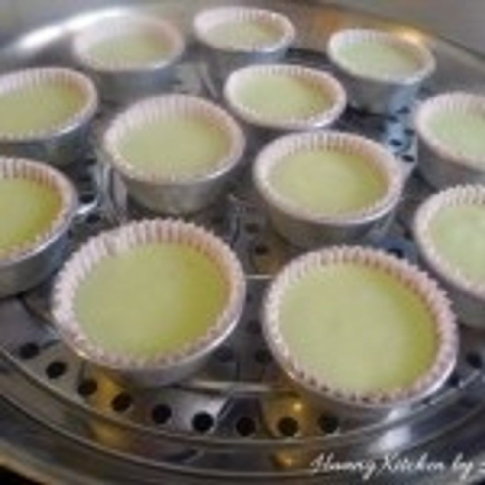 In batches, steam the batter in steaming cups over simmering water in a covered wok.