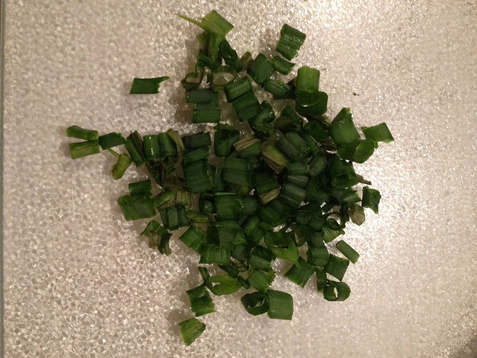 In between stirring, chop green onions and set aside.