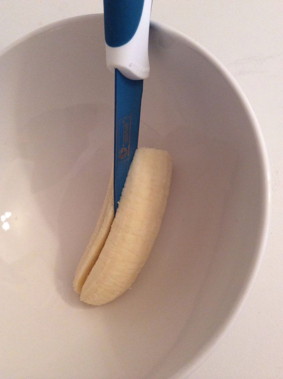 In-between stirring, cut your banana! First lengthwise..