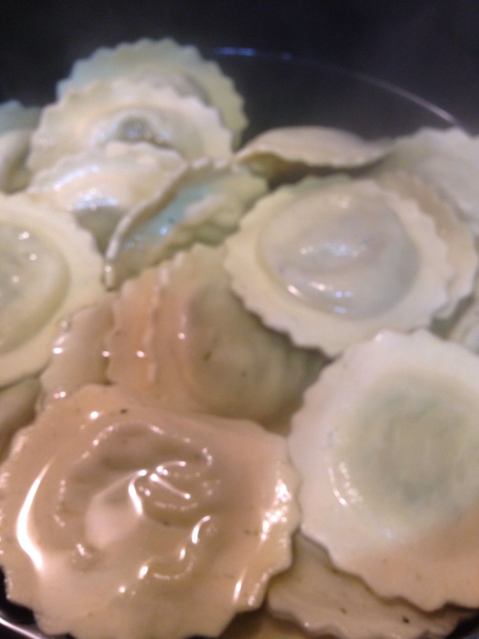 In boiling water, add ravioli. Reduce to low heat and let it cook according package instruction.