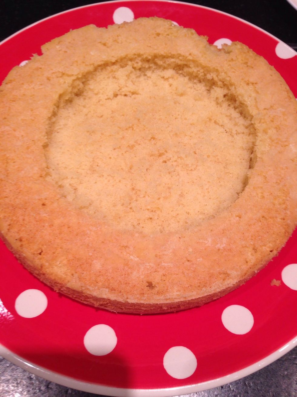 in both of the sponges cut away small little holes (be careful not to go right through the cake)