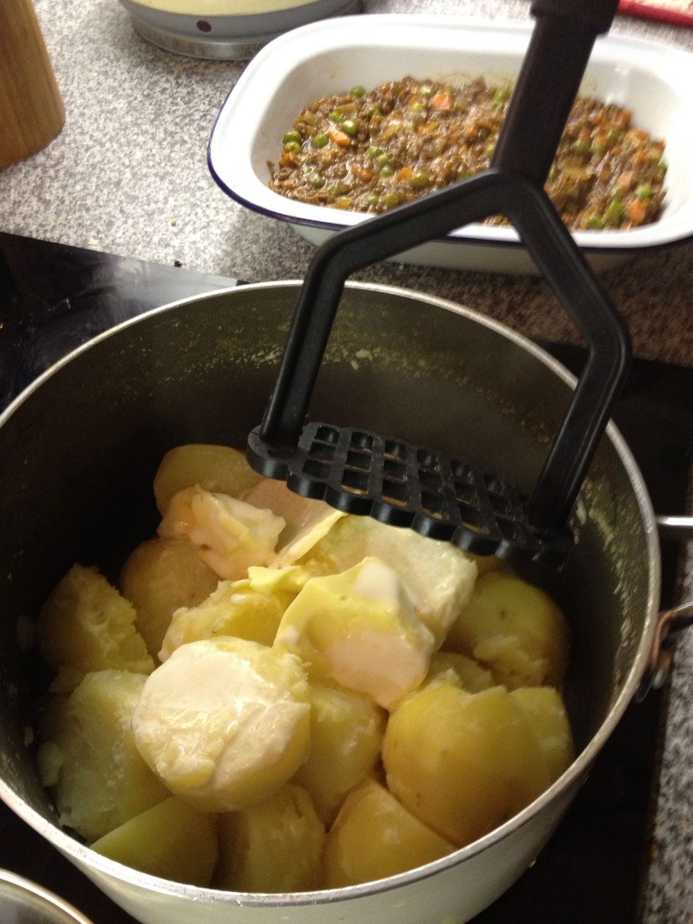In goes 2oz of real butter, 100 mls of single cream and a dash of milk. Season to taste.