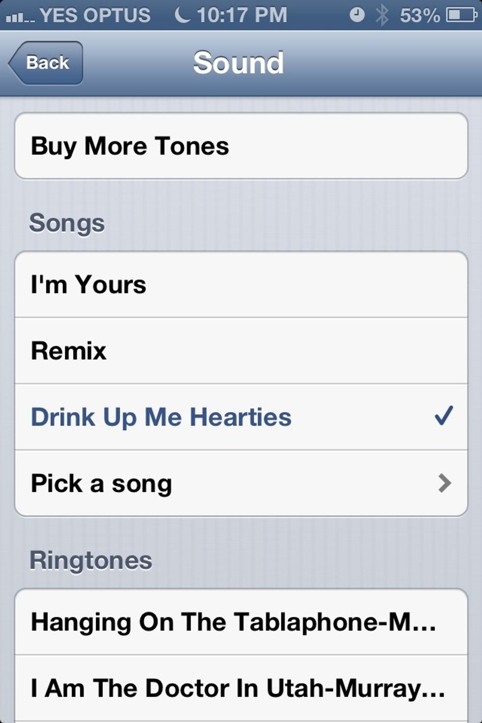 In iOS6 you can choose a song as a wake up alarm. By creating a new alarm in the clock app.