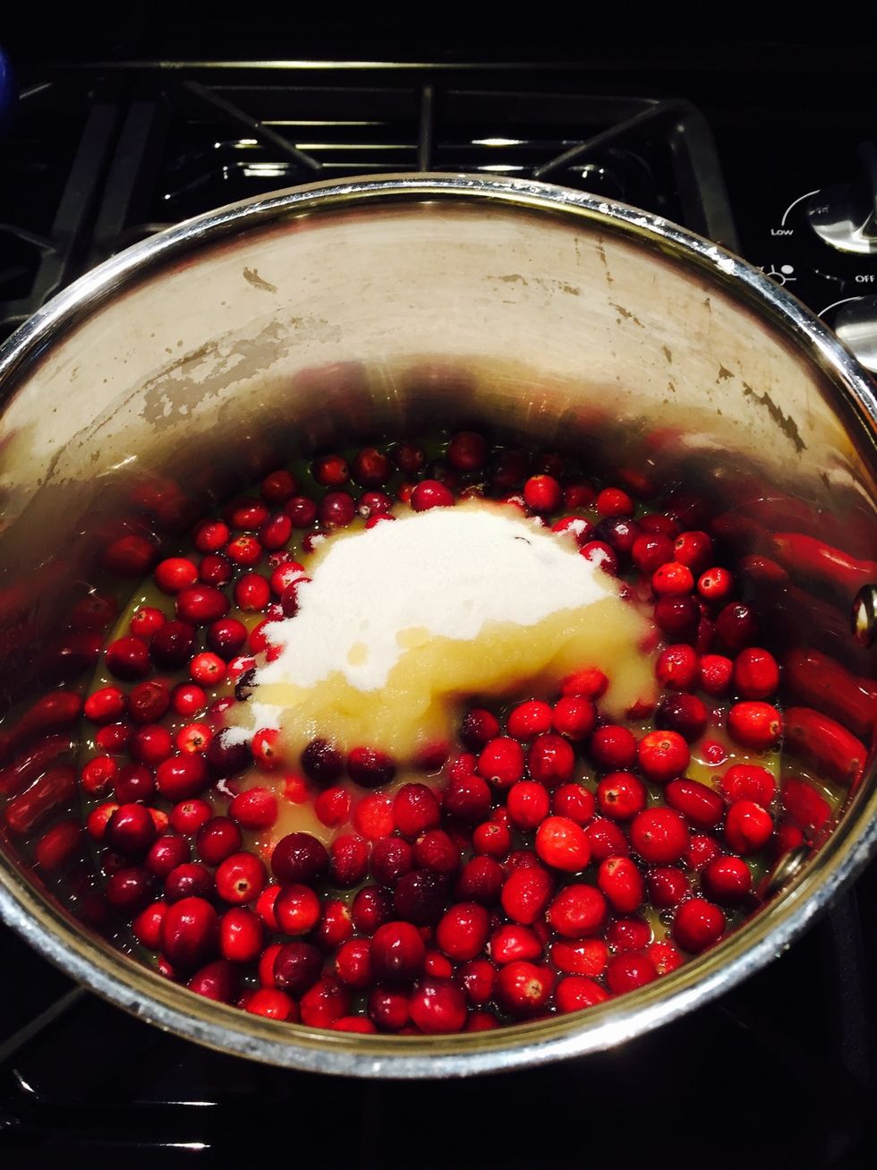 In med sauce pan add 12 oz bag fresh cranberries, 1 1/4C sugar, 1T orange zest, 1C OJ on med heat until you start to hear berries pop--10-15 minutes total. Turn off heat, set aside to cool.