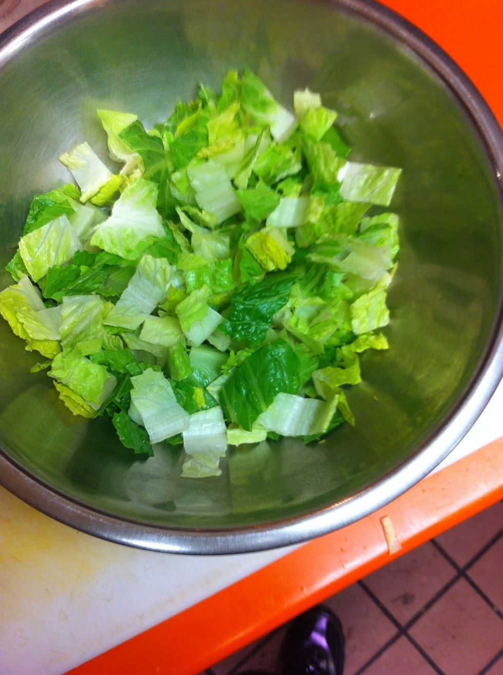 In mixing bowl, place Romaine Heart (rinsed, dried and chopped)