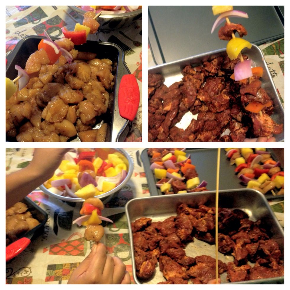 In no particular order begin to assemble the meat and veggies on the sticks. I keep the two meats separate because they cook at different rates.