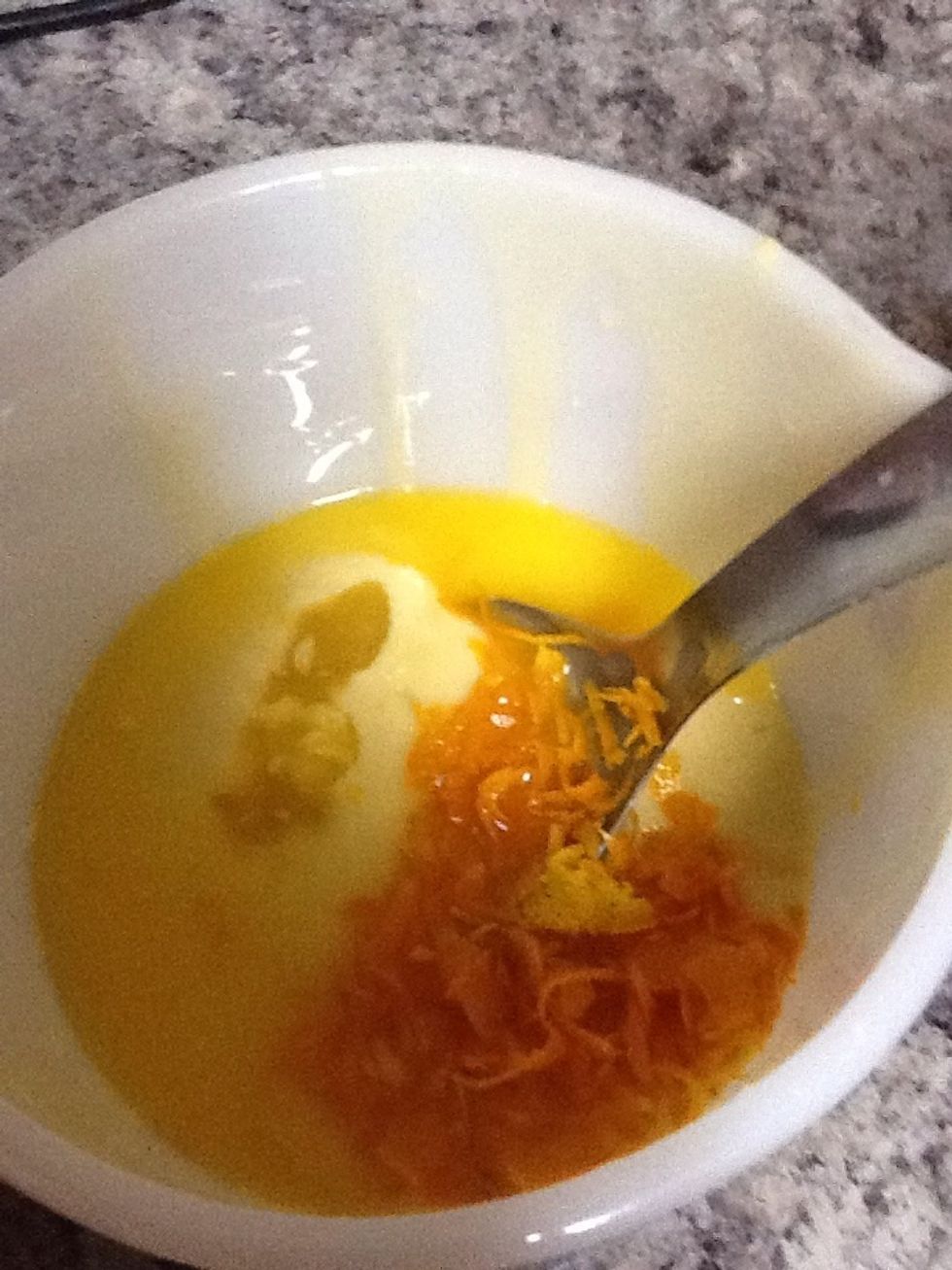 In one of the bowls pour on the orange zest and the orange juice.