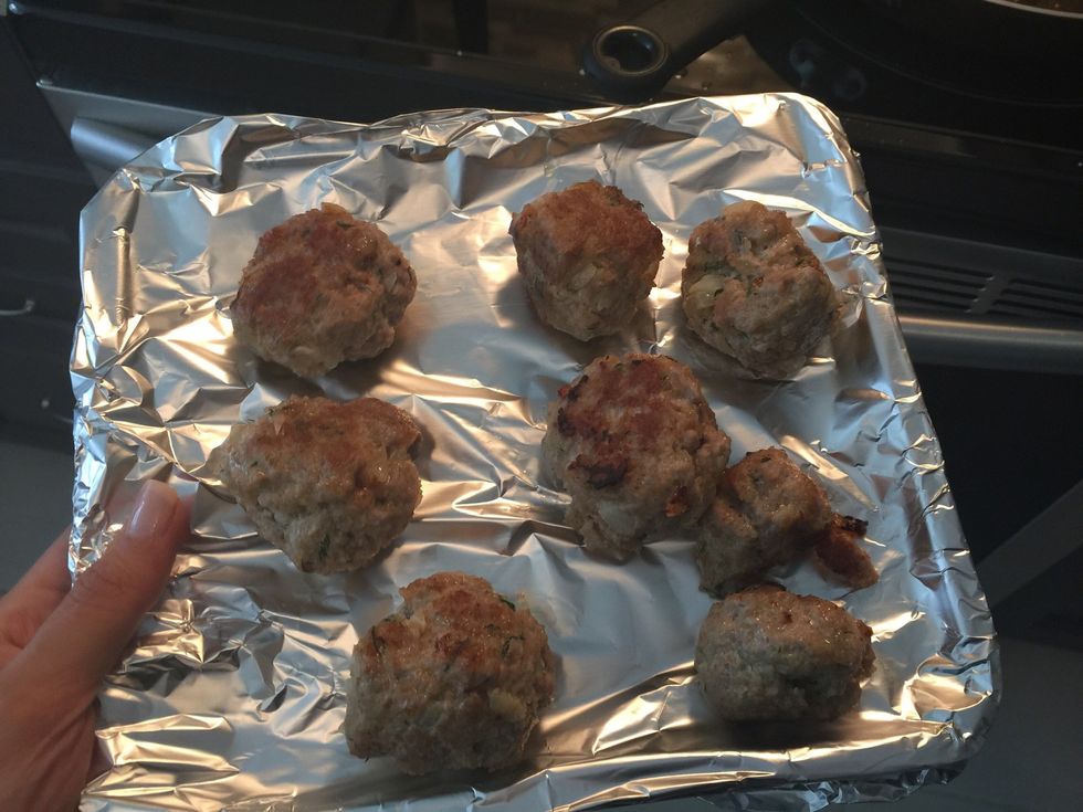 In order to ensure the centre of meatballs are cooked, place them in preheated oven (350 F) and bake for 15-20 min.