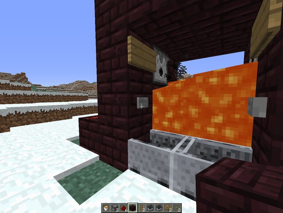 in order to go out, just press button and wait until lava goes down, and then go out