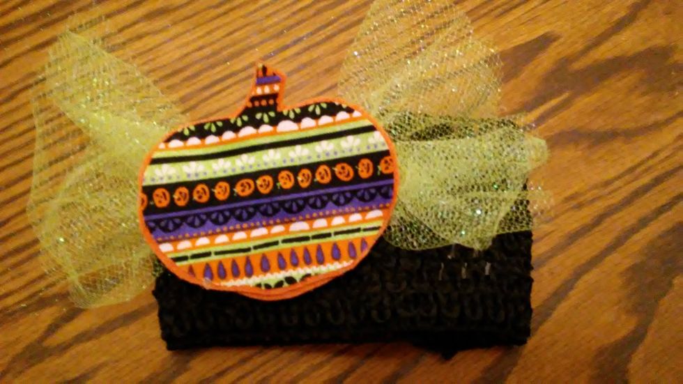 In order to make the bows interchangeable on the headband I hot glued a clip to the back of the bow. Just clip the bow to the headband when you are ready to wear it.