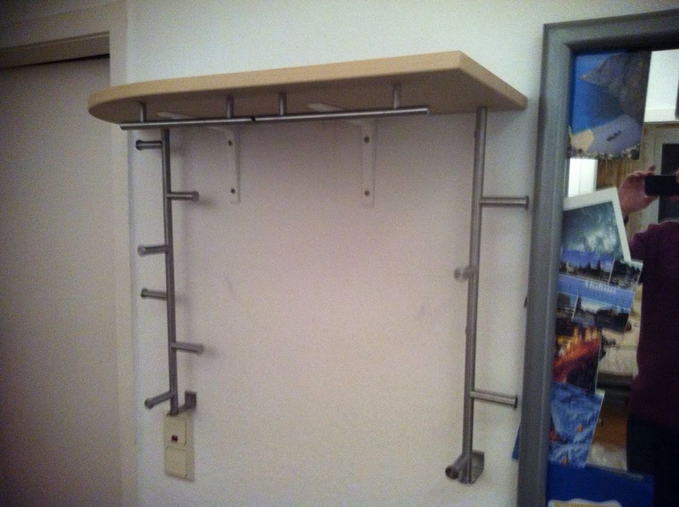 In our old flat we used an IKEA Galant desk for the shelf, because it was rounded on one side so we wouldn't hit it with our heads when going to the bathroom.