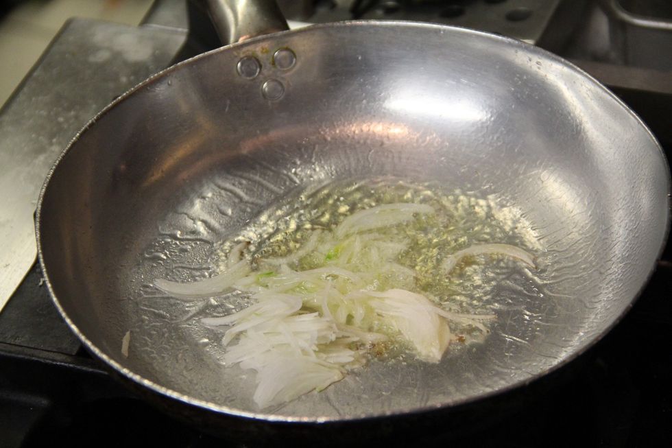 In pan saut\u00e9 your chopped onions together with a clove of garlic