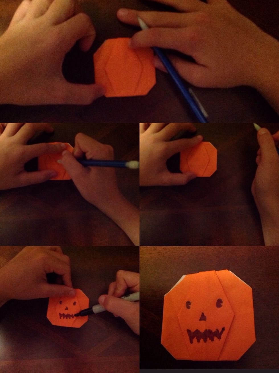 In pencil, draw the face that you want on your pumpkin in go over it in marker.