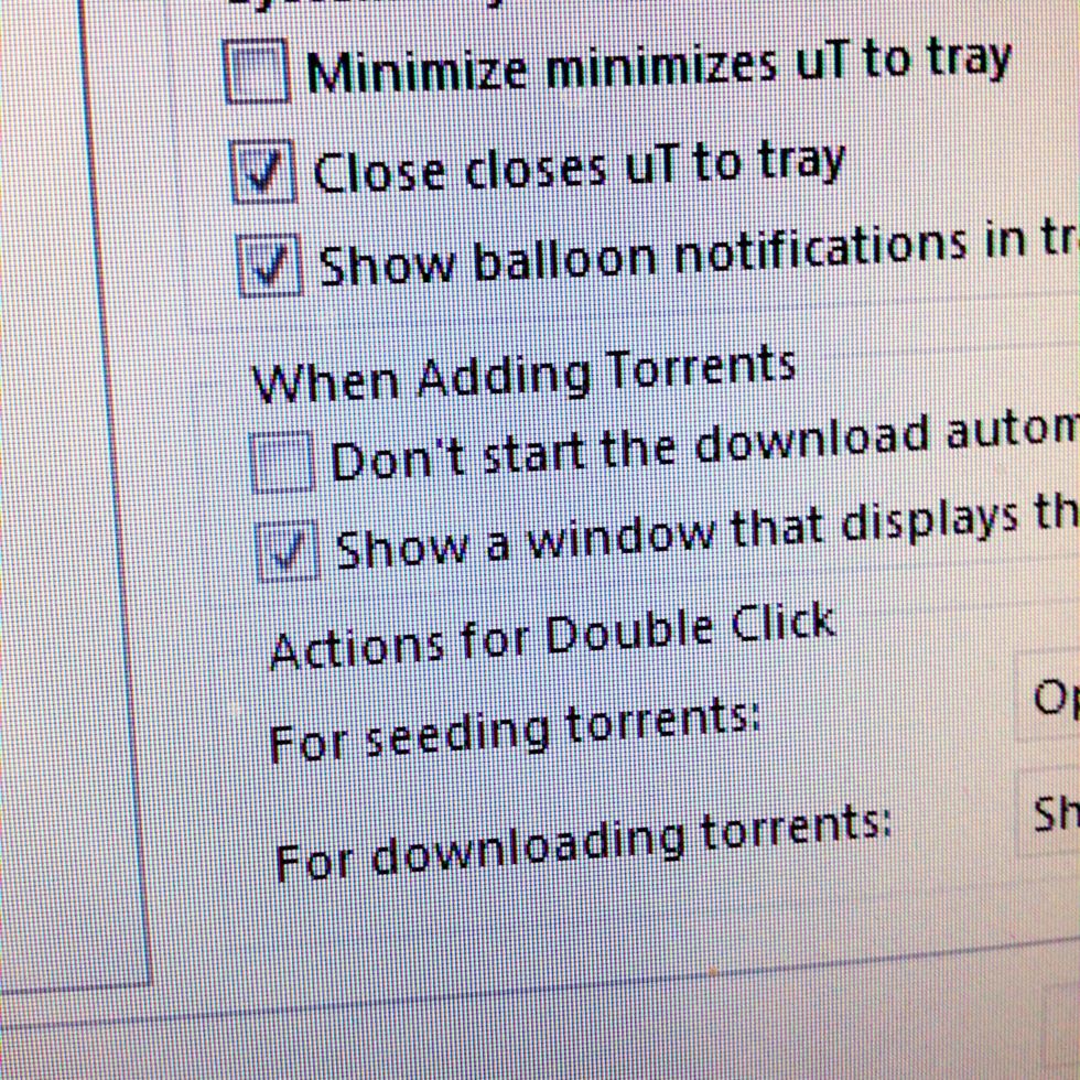 In preferences on the left side, choose UI Settings and uncheck the option at the bottom saying "Show a window that displays the files inside the torrent in advanced mode.".