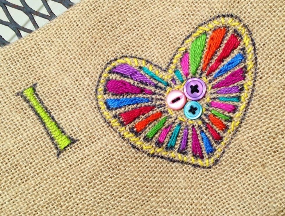 in sample, horizontal long stitches were used to fill in "i" with lime thread and assorted colors were used on the heart. random stitches in yellow for outline.