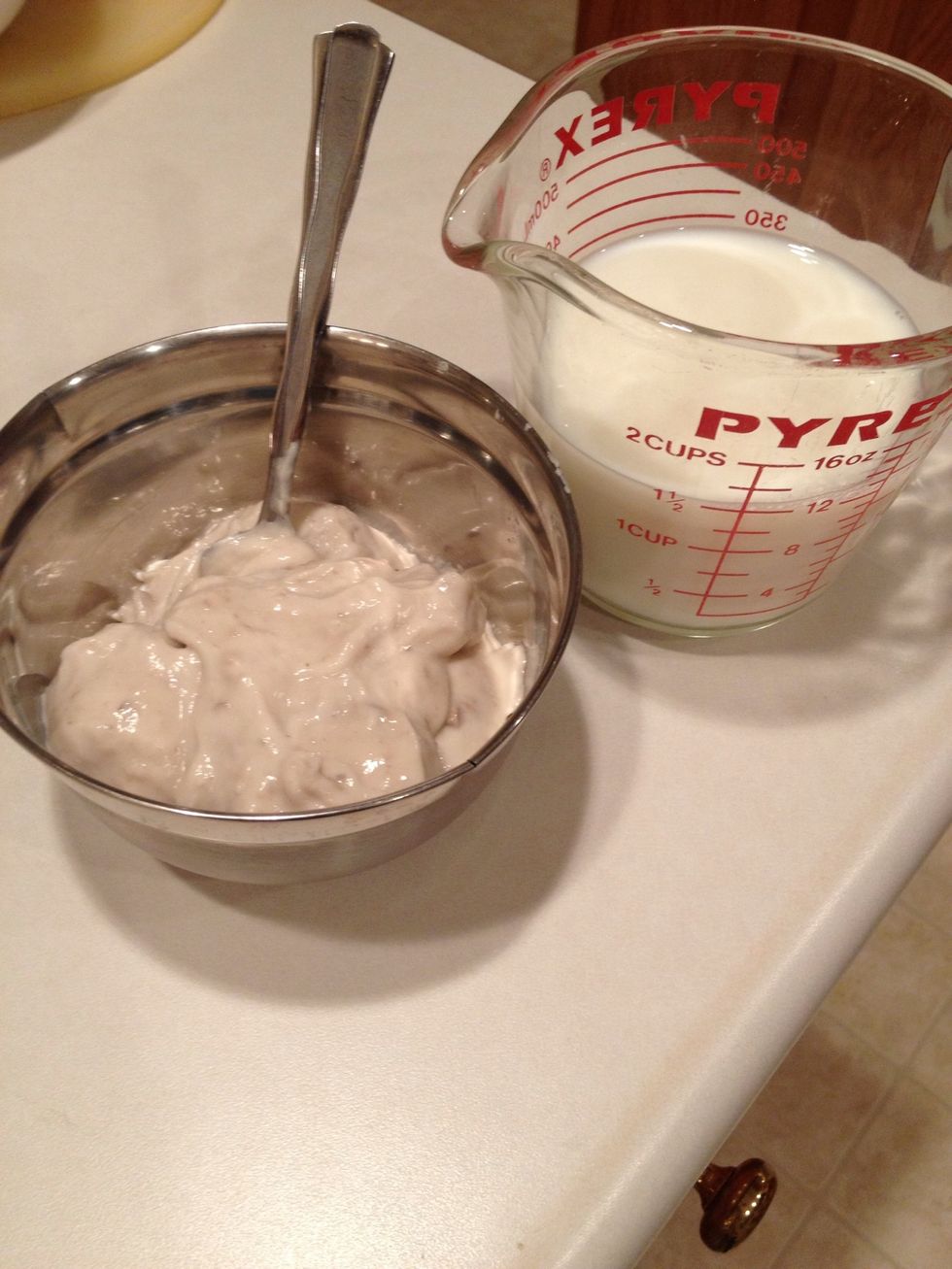 In separate container, mix cream of mushroom soup and milk.