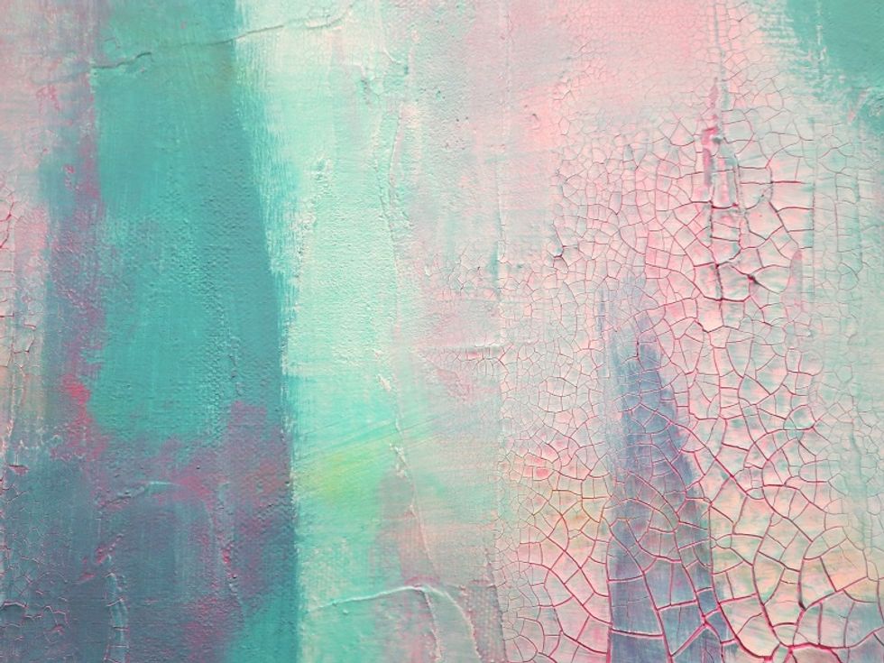 In some spots where the molding paste was either missed or very thin you can still see the canvas's original texture.