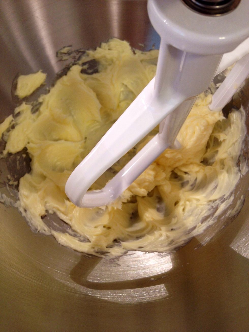 In stand mixer, cream butter. Then add sugar and brown sugar. Mix until light and fluffy.
