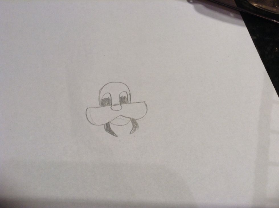 In the 2 smaller bumps draw half of them black and draw 2 pointy teeth on each side