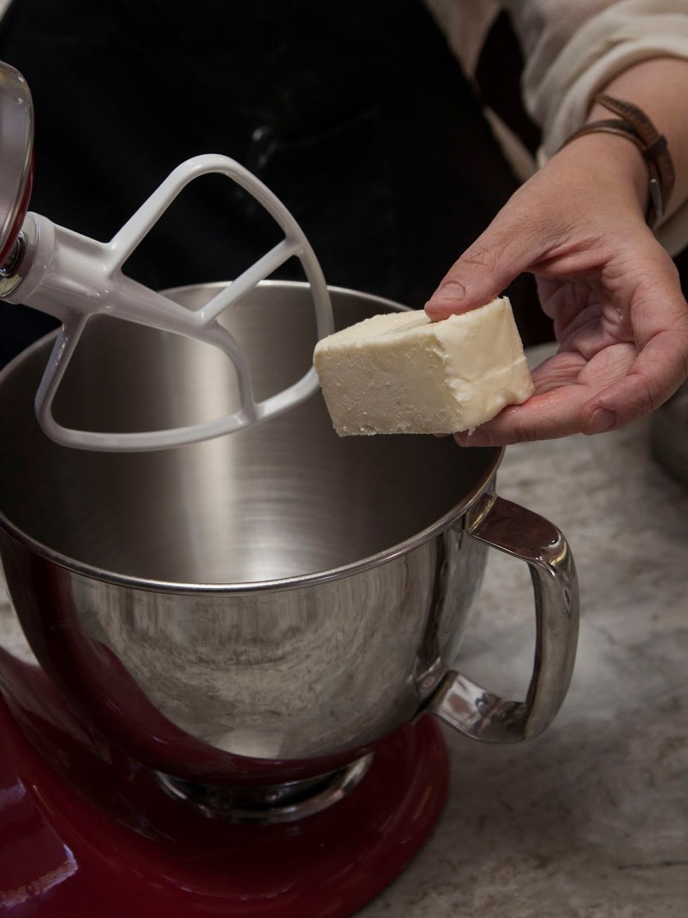 In the bowl of a stand mixer, add the softened stick of unsalted butter.