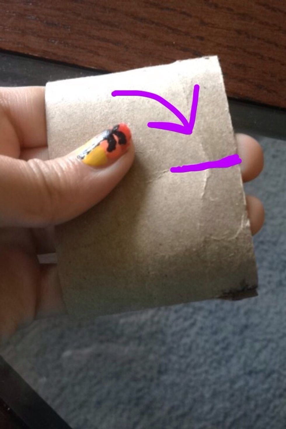 In the creases you just created cut a slit - should be 4 slits in total.