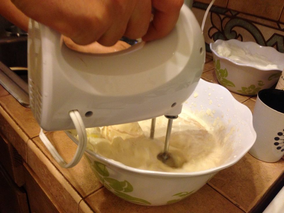 In the egg yellows bowl, add the sugar, mascarpone cheese,whipping cream and Marsala wine and then mix with your electric mixer until it's smooth.