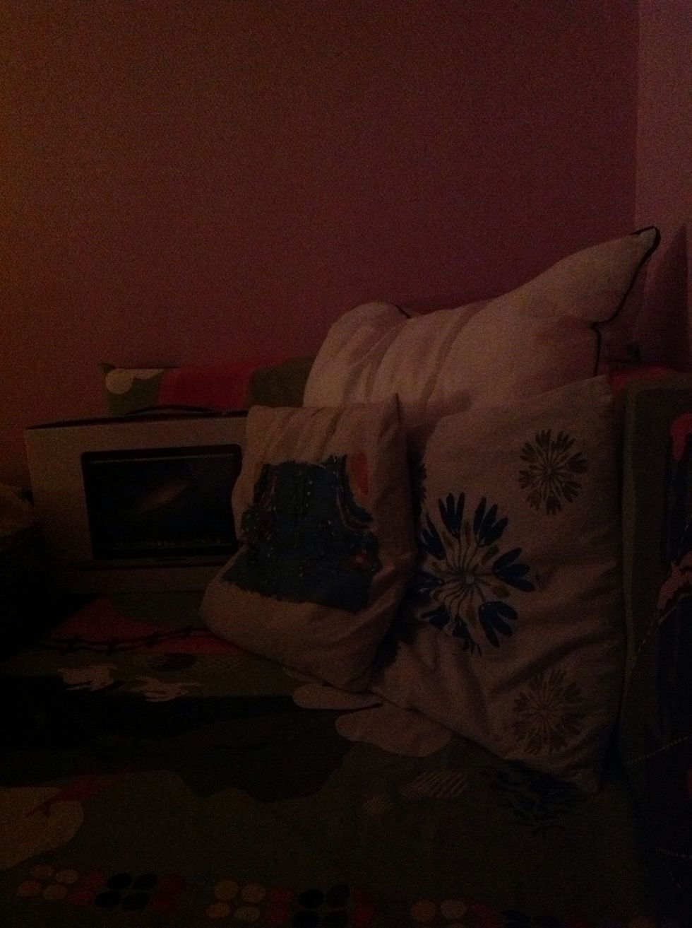 In the end of my bed I got a little sofa corner. I like to have my MacBook box there so I have my charger headphone and stuff like that, close to me.