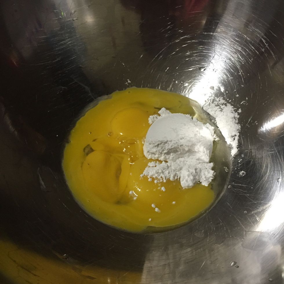 In the first bowl, whisk yellow egg with 1/4 cup of sugar.
