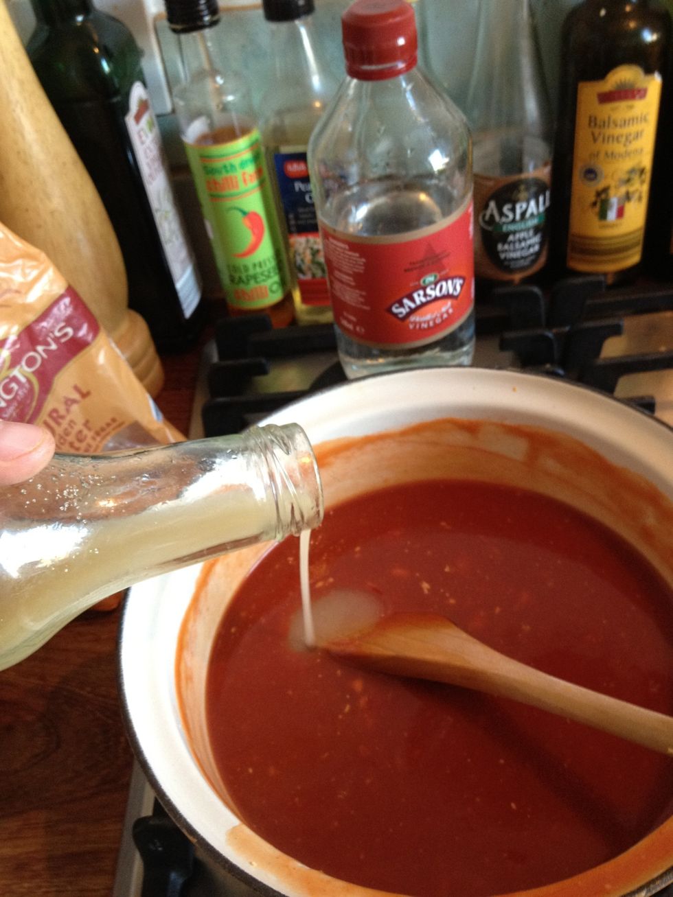In the ketchup bottle mix together the remainder of the water and all of the sugar, shake well and add to the sauce.