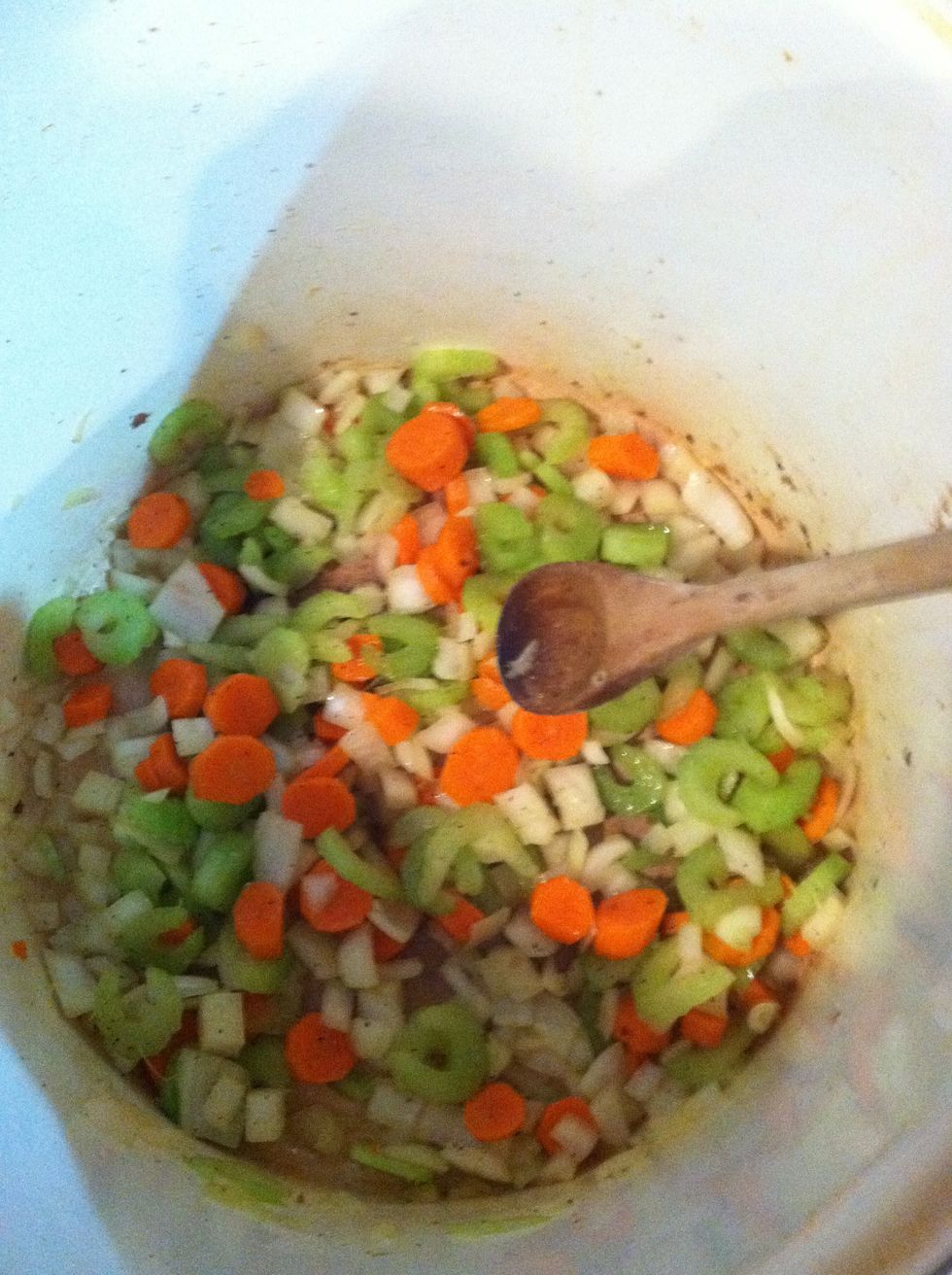 In the large pot, add remaining oil and heat up. Cook the veggies for about 10 minutes until soft and slightly browned. Once browned, add 6 Tbsp flour, stir/combine and cook about 3 more minutes.