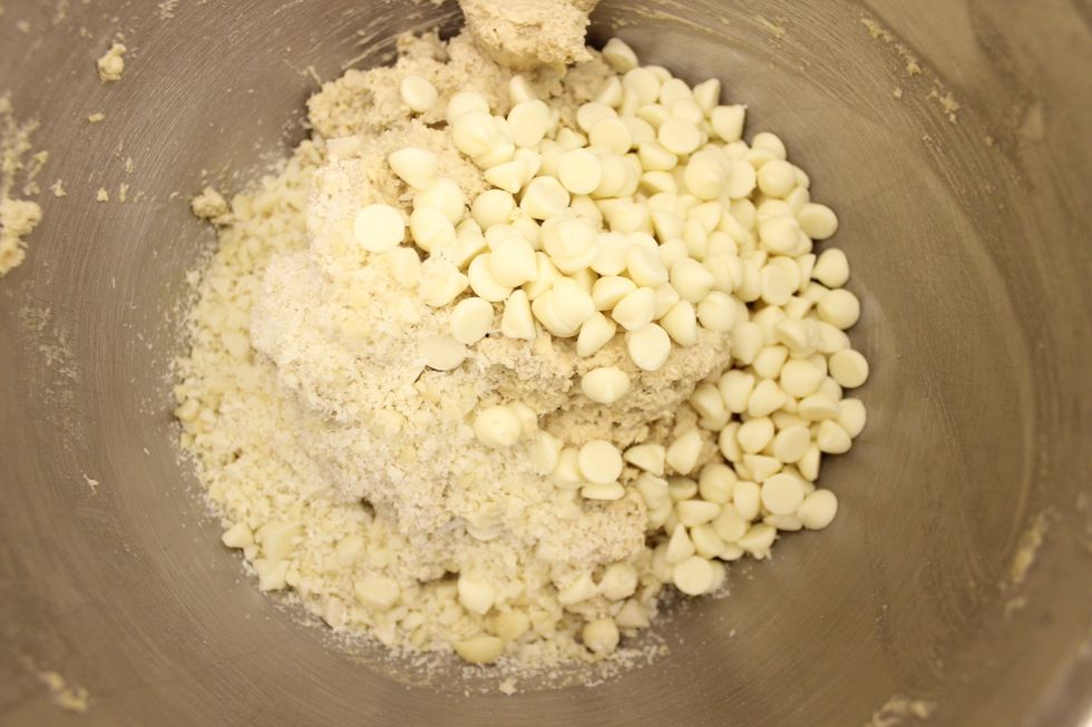 In the leftover half of the dough that is remaining in the mixing bowl, add the white chocolate chips and macadamia nuts (chopped).