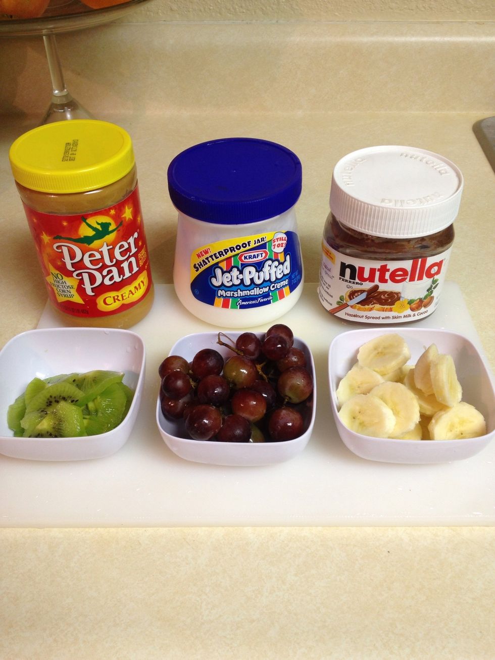 In the mean time, while the cookies are baking, cut up your fruits & gather your spreads (ie: peanut butter, marshmallow creme & nutella).