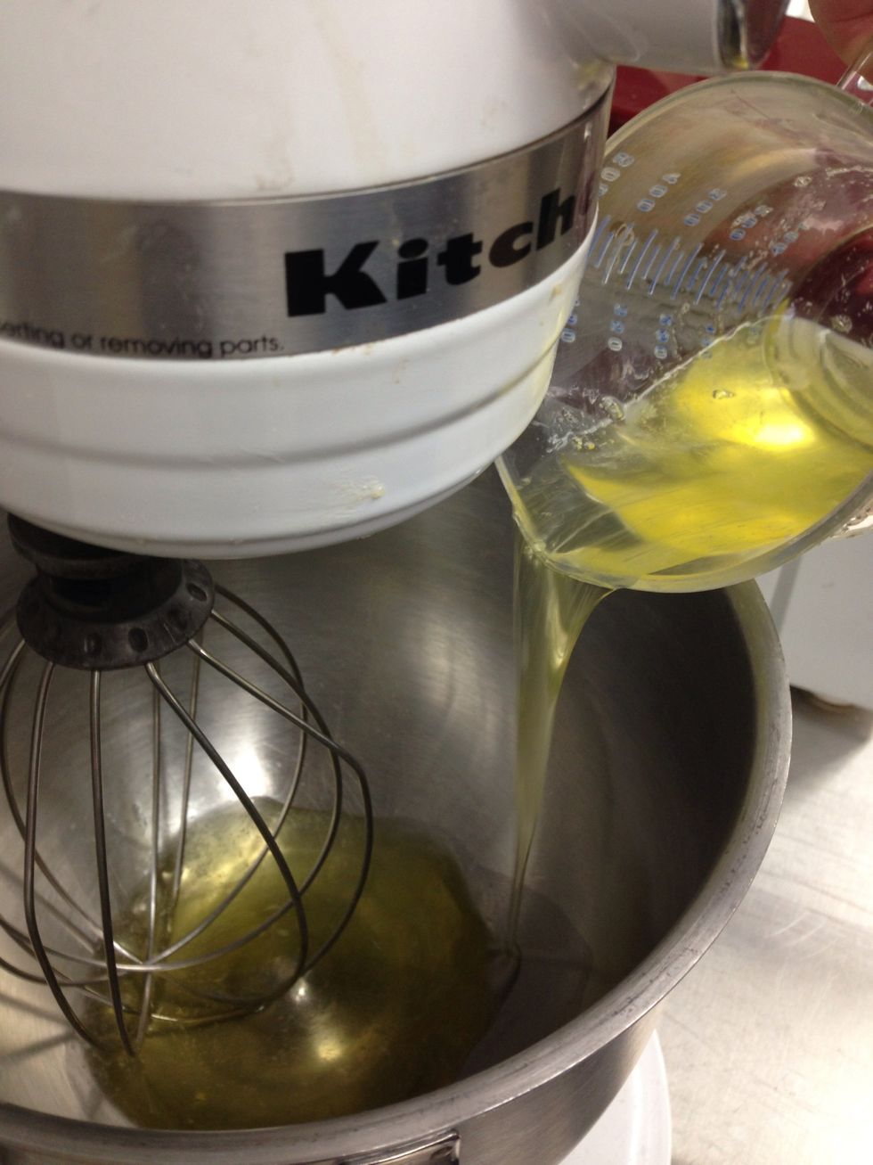 In the meantime add first 110 g of egg white to mixing bowl.