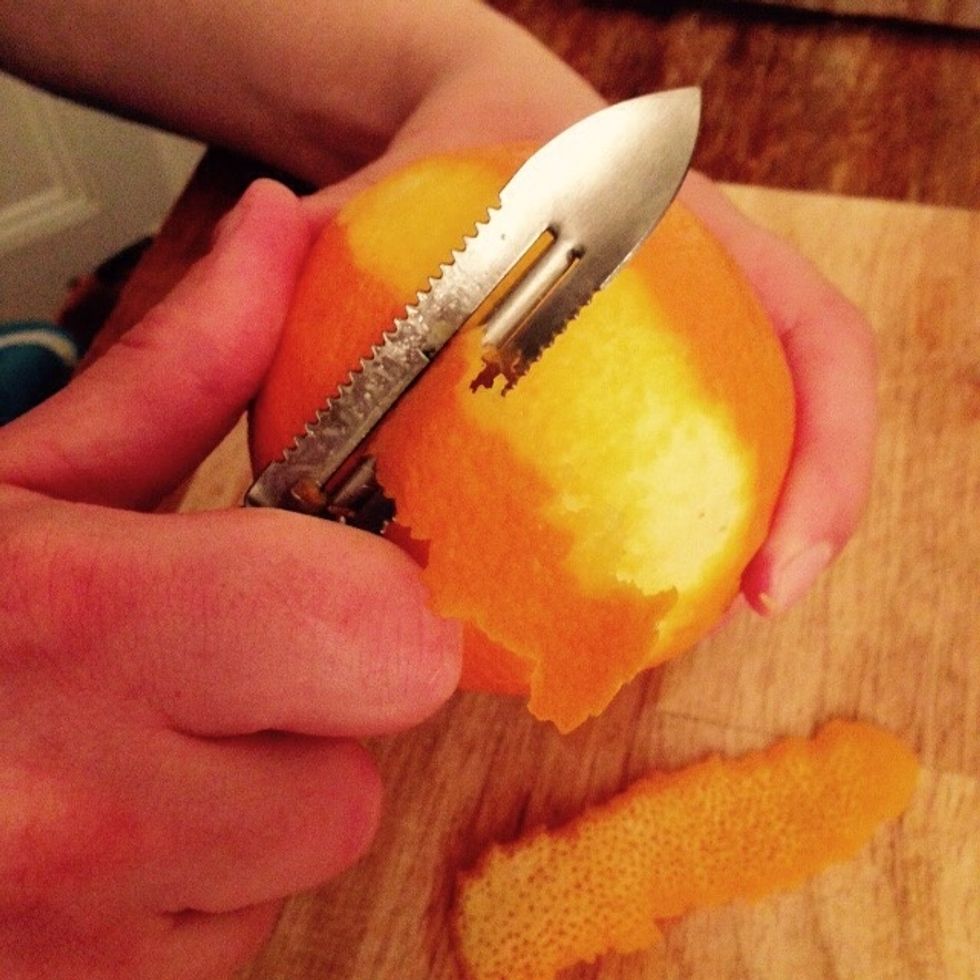 In the meantime peel the orange skin avoid scraping any of the white that would result bitter, set aside.