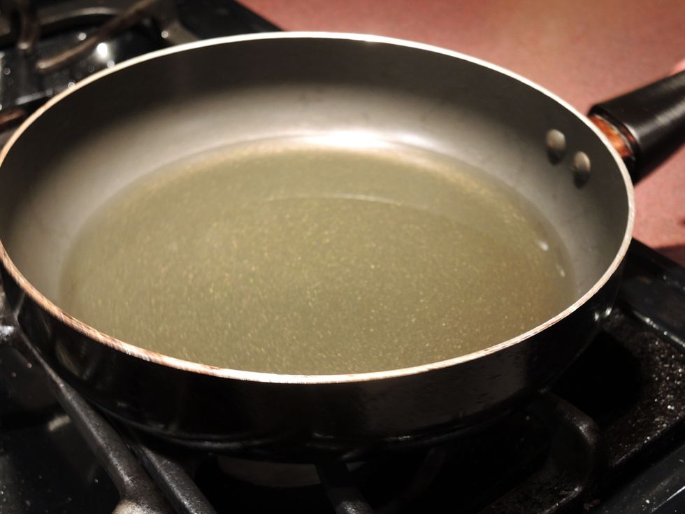 In the meantime, pour the vegetable oil into the pan until you have about half an inch of oil in the pan. Put it on the stove on high.