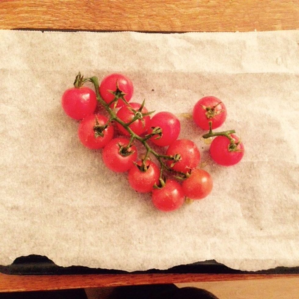 In the meantime take care of the vine grape tomatoes. Place them in a baking tray, drizzle with olive oil and season with pepper and salt. Bake at 220C for 10min