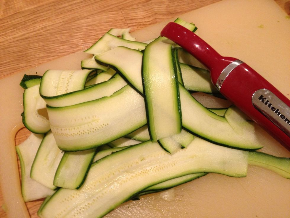 In the meantime use a vegetable peeler to create ribbons of courgettes. You'll need one courgette per person