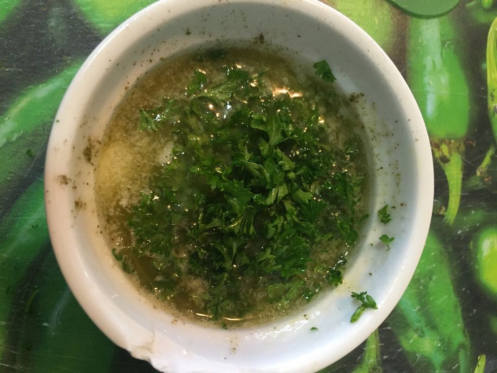 In the microwave, melt butter, garlic salt, and parsley. As soon as the cheese bomb came out from the oven, brush the butter mixture.