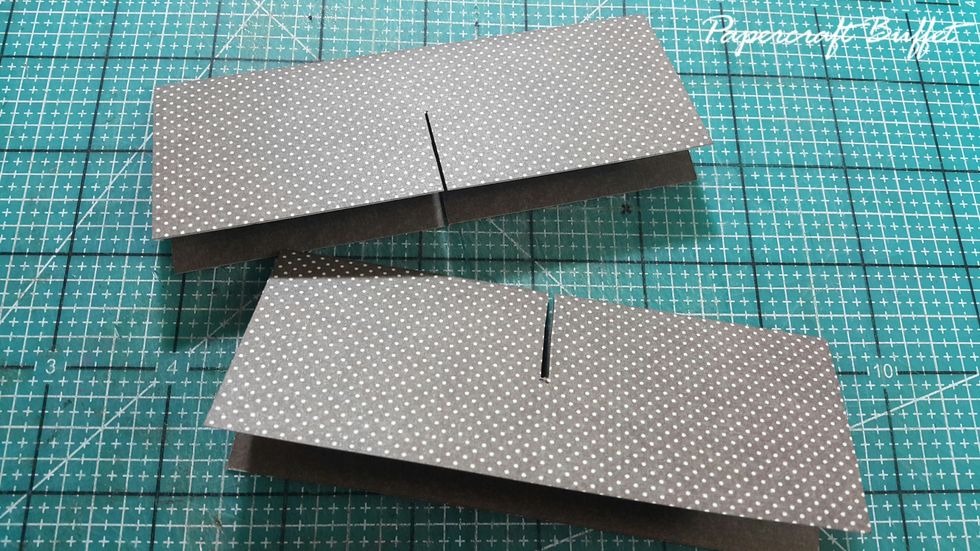 In the middle of the strips, cut out a gab for them to be insert into each other.