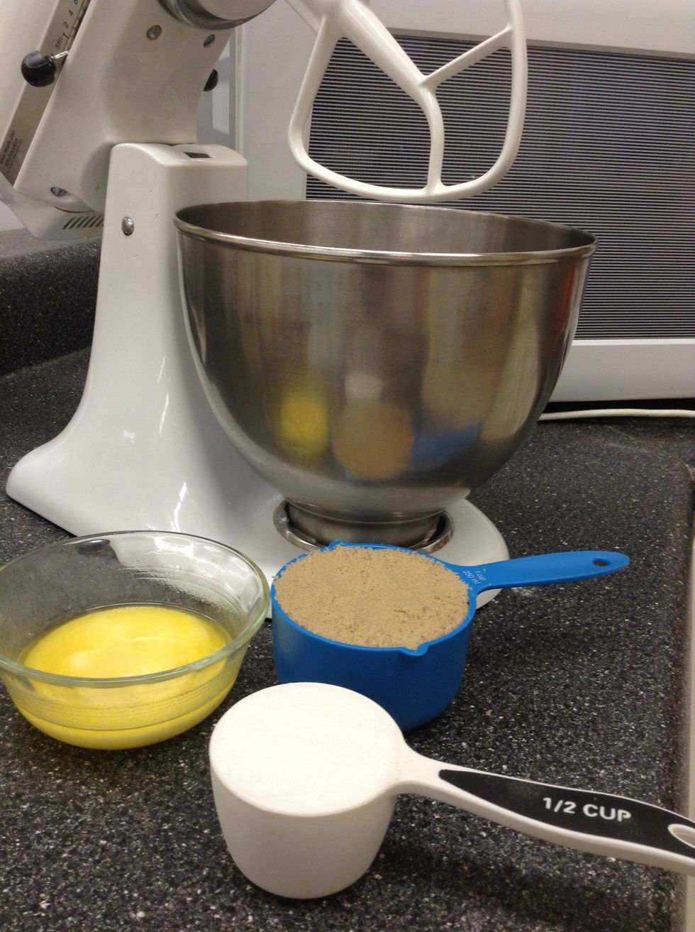 In the mixer cream together the melted butter,sugar and brown sugar