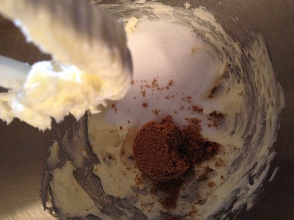 In the mixing bowl cream the sugars and butter until light and fluffy.