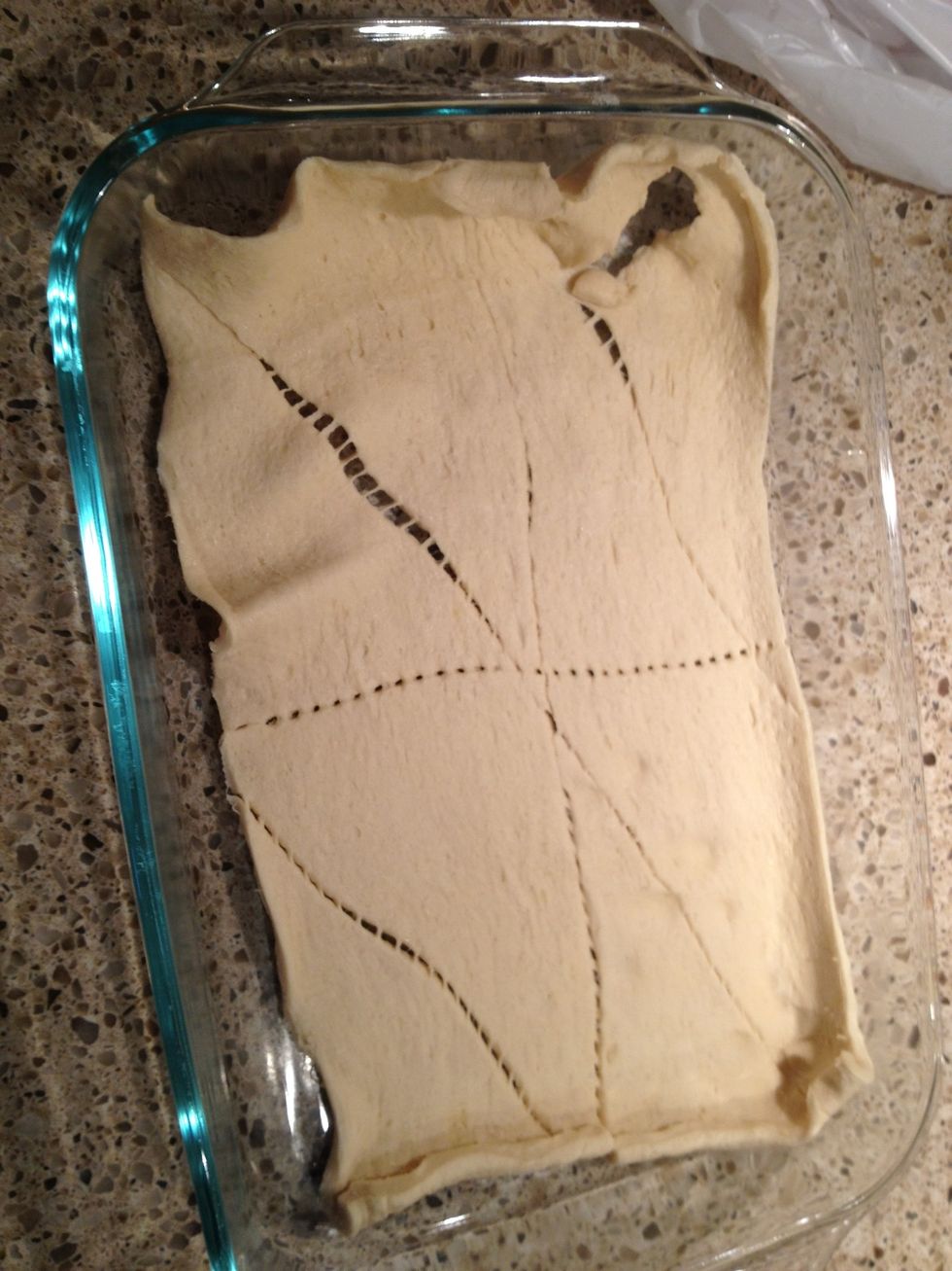 In the morning, roll out a can of crescent rolls in the bottom if a 13 x 9 inch baking dish.