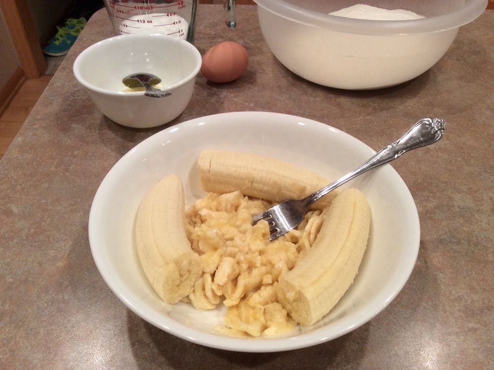 In the other large bowl, use a fork or potato masher to mash the bananas