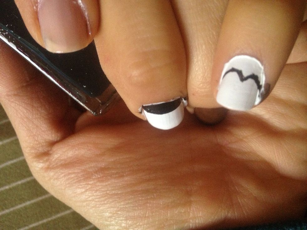 In the other nail with white nail polish do like 2 moons