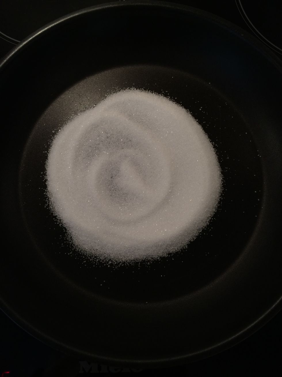 In the pan and on high. Start the caramel by putting 1/4 of the sugar