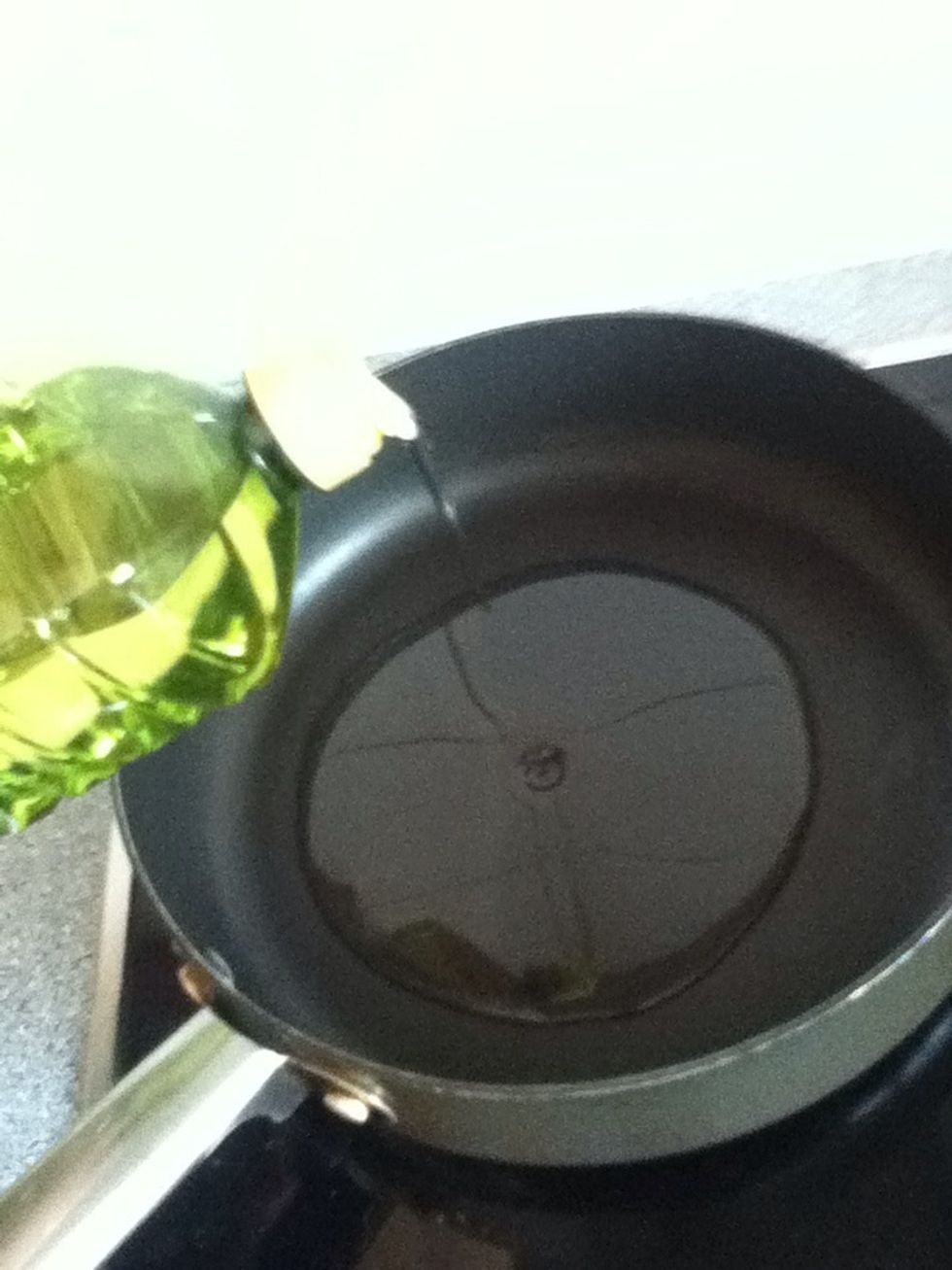 In the pan put oil.