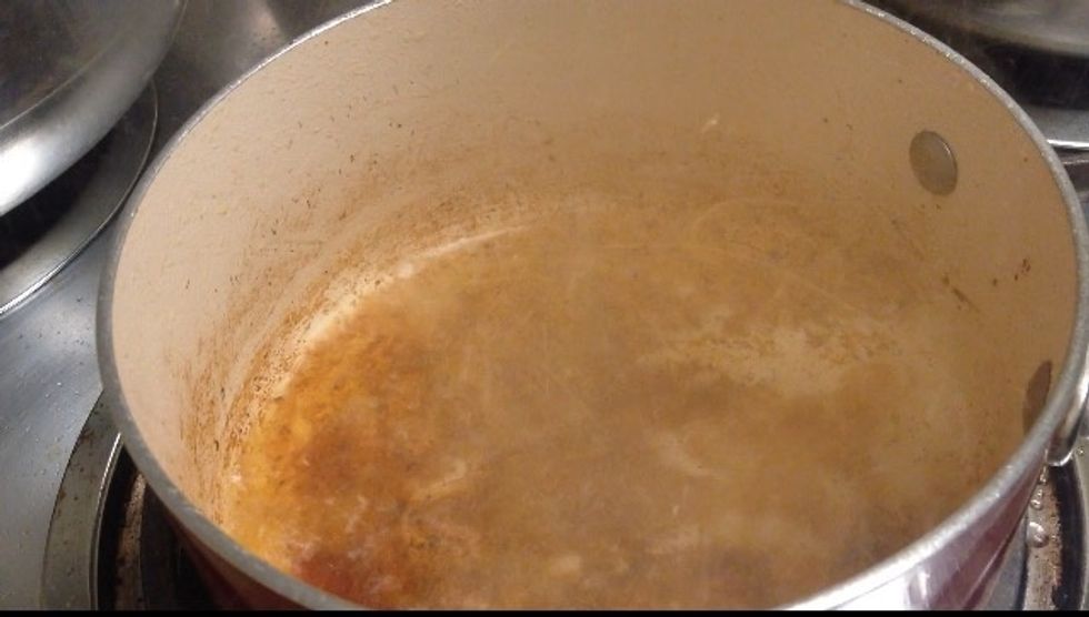 In the same pan add 2 cups of hot water