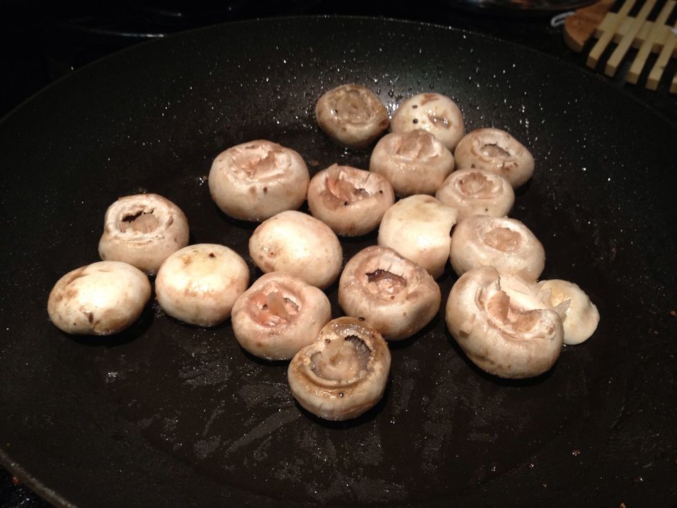 In the same pan, remove the stems from the mushrooms and saut\u00e9 them.